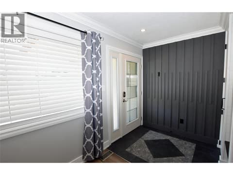Inside the front door. Beautiful cabinetry and a tiled floor at 562 Meadowlark Avenue, Okanagan North, Vernon