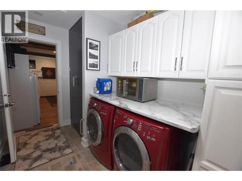 Laundry area with plenty of storage at 562 Meadowlark Avenue, Okanagan North, Vernon
