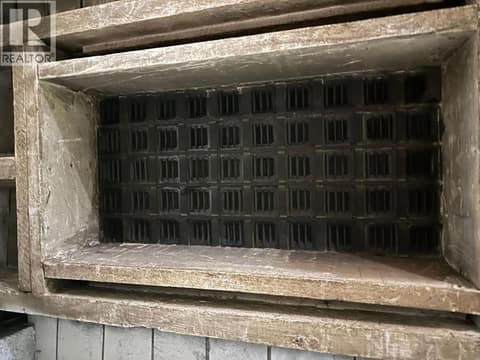 Lower level old grate in the ceiling at 3107 30 Avenue, City of Vernon