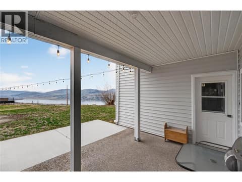 In-law suite's patio with view of the lake at 7292 Mountridge Road, North BX, Vernon