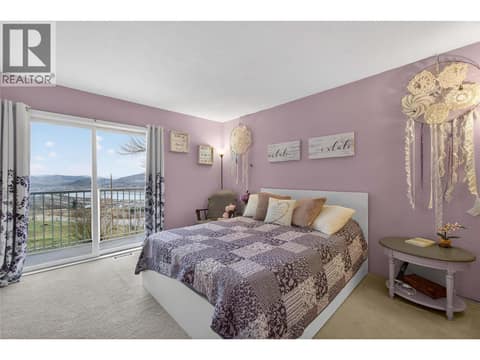 Primary Bedroom up with private balcony at 7292 Mountridge Road, North BX, Vernon