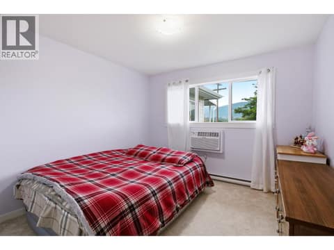 Primary Bedroom, new windows, carpet and new paint at 4004 34 Street Unit# 207 Lot# 15, Alexis Park, Vernon