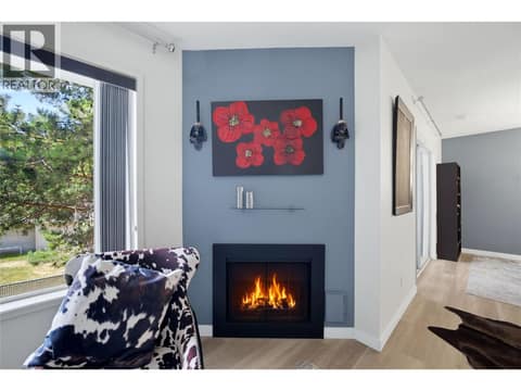 Fireplace has been virtually altered to have a flame at 2806 35 Street Unit# 207, City of Vernon