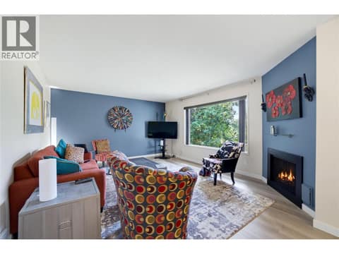 The fireplace has been virtually altered* (To reflect a flame) at 2806 35 Street Unit# 207, City of Vernon