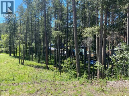 Flat lot with front AND back access at 867 Balsam Road, Fintry, Kelowna