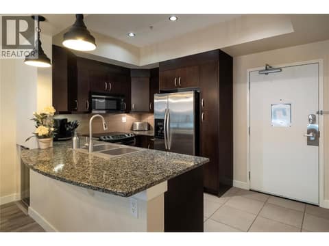 Kitchen with sit up granite bar at 7343 Okanagan Landing Road Unit# 1130, Okanagan Landing, Vernon