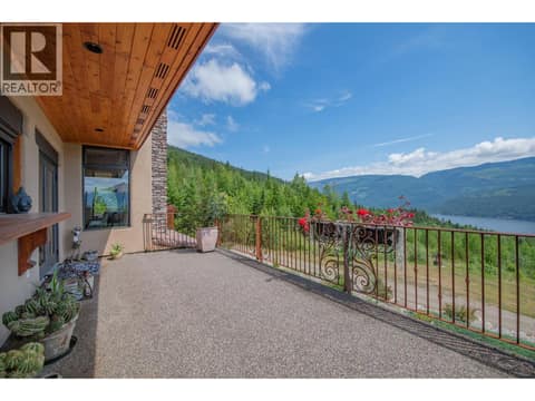 Deck right off the kitchen/living room at 1309 Eagle Ridge Road, Mabel Lake South, Lumby