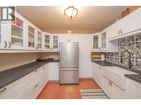 Summer kitchen in the basement at 1309 Eagle Ridge Road, Mabel Lake South, Lumby