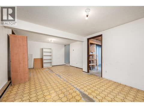 Flooring is now replaced with laminate at 5008 Heritage Drive, Westmount, Vernon