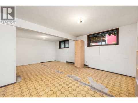 Flooring is now replaced with laminate at 5008 Heritage Drive, Westmount, Vernon