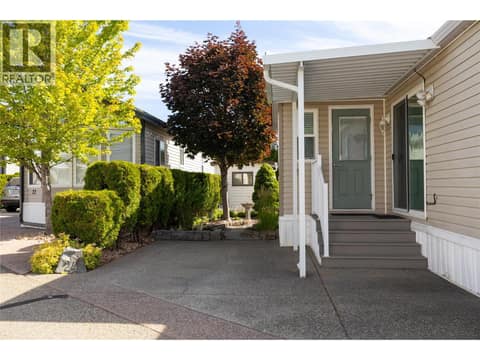 Front view and side yard at 8000 Highland Road Unit# 24, Swan Lake West, Vernon