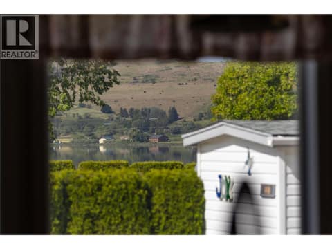 Glimpse view of Swan lake at 8000 Highland Road Unit# 24, Swan Lake West, Vernon