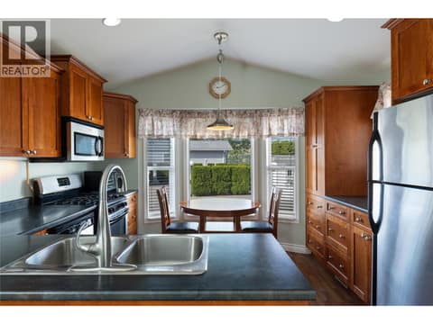 Living room to kitchen view at 8000 Highland Road Unit# 24, Swan Lake West, Vernon