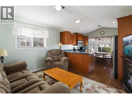 Open concept living room and kitchen at 8000 Highland Road Unit# 24, Swan Lake West, Vernon