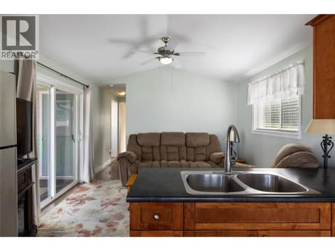 View from your kitchen toward the rear of your home at 8000 Highland Road Unit# 24, Swan Lake West, Vernon
