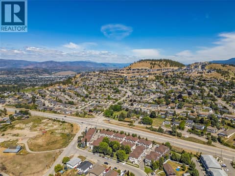 Bare land on the left is where the proposed Black Mountain Village Center is slated to be. at 1651 Lynrick Road Unit# 128, Black Mountain, Kelowna