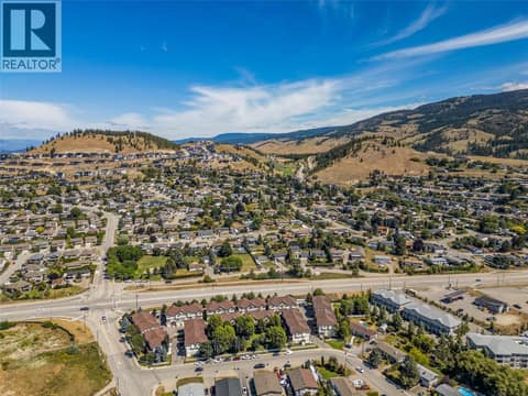 Black Mountain Golf Club is the green area in the center of this picture. at 1651 Lynrick Road Unit# 128, Black Mountain, Kelowna