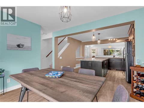 Dining area looking back into the kitchen with the living room in the background. at 1651 Lynrick Road Unit# 128, Black Mountain, Kelowna