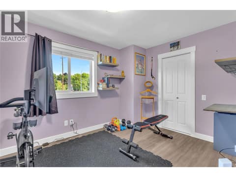 Third bedroom on the upper floor. Currently used as a gym Walk in closet in this room. at 1651 Lynrick Road Unit# 128, Black Mountain, Kelowna