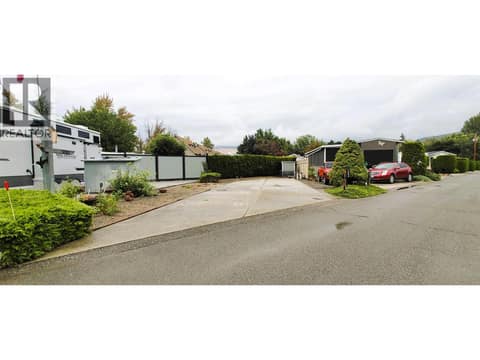 Wide street for ease of backing into the lot. at 415 Commonwealth Road Unit# 803, Lake Country South West, Kelowna