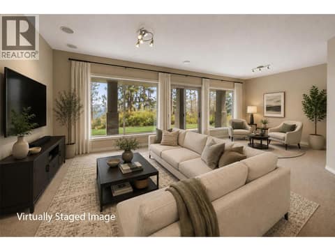 Downstairs Family room *This picture has been virtual staged to show how it might look. The furniture and decorations are not real and are just for illustration. The actual space may look different. at 4520 GALLAGHERS Lookout Unit# 2, South East Kelowna