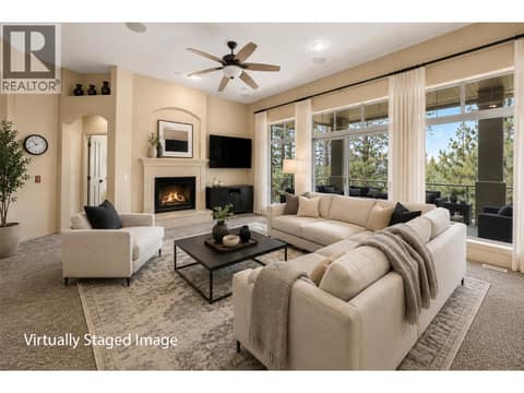 Living room *This picture has been virtual staged to show how it might look. The furniture and decorations are not real and are just for illustration. The actual space may look different. at 4520 GALLAGHERS Lookout Unit# 2, South East Kelowna