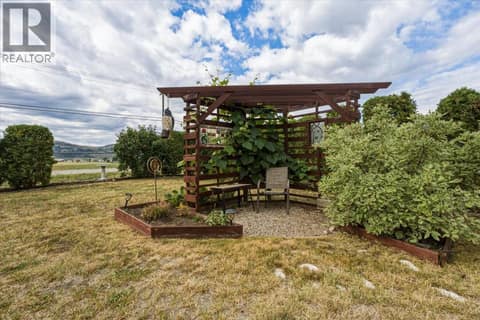 Backyard with nice gazebo covered in grapes for wine making! at 12560 Westside Road Unit# 51, Swan Lake West, Vernon