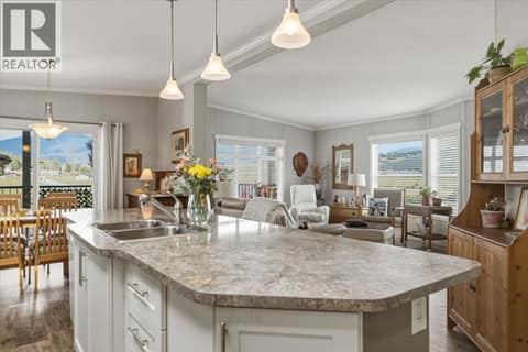 Beautiful kitchen island and open entertaining area at 12560 Westside Road Unit# 51, Swan Lake West, Vernon