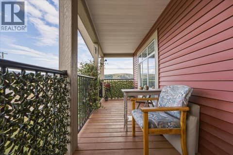Enjoy the covered porch while sipping your morning coffee at 12560 Westside Road Unit# 51, Swan Lake West, Vernon