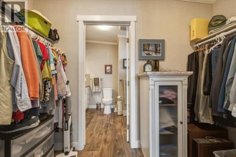 His and Hers walkthrough closet to ensuite at 12560 Westside Road Unit# 51, Swan Lake West, Vernon