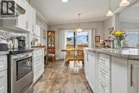 Seamless kitchen and dining room at 12560 Westside Road Unit# 51, Swan Lake West, Vernon