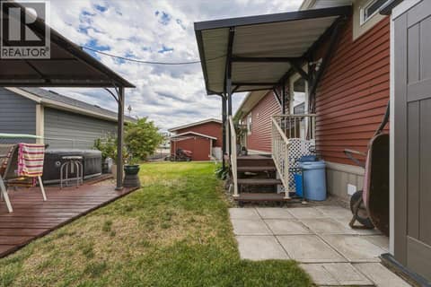 Side door access to backyard. at 12560 Westside Road Unit# 51, Swan Lake West, Vernon