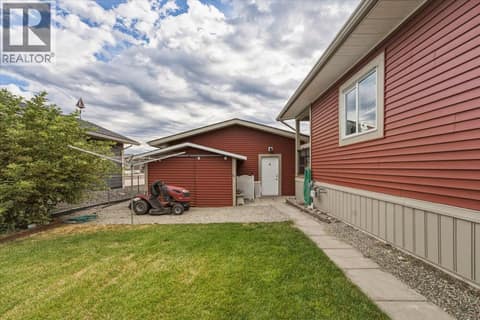 View back towards garage, plus extra storage in matching shed on left. at 12560 Westside Road Unit# 51, Swan Lake West, Vernon