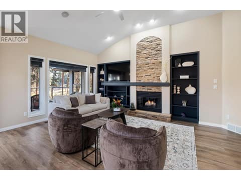 Fireplace in family room at 3907 Gallaghers Circle, South East Kelowna