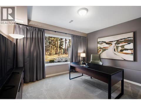Lower level bedroom with view of golf course at 3907 Gallaghers Circle, South East Kelowna