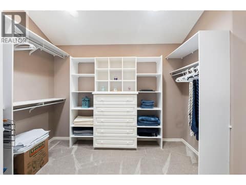 Primary bedroom walk in closet at 3907 Gallaghers Circle, South East Kelowna