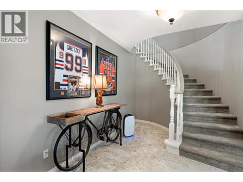 Spiral stairs to lower level at 3907 Gallaghers Circle, South East Kelowna