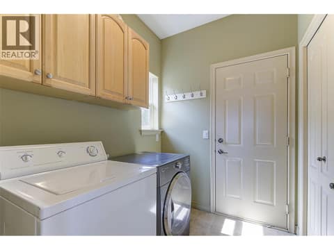 Laundry room off of Double Garage at 1950 CAPISTRANO Drive Unit# 133, University District, Kelowna