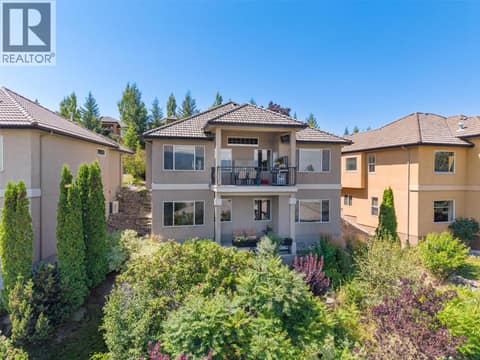Sloping Backyard with Shrubs and Trees at 1950 CAPISTRANO Drive Unit# 133, University District, Kelowna