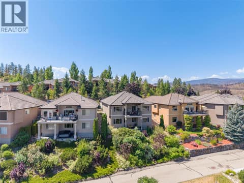 Sloping Backyard with Shrubs and Trees at 1950 CAPISTRANO Drive Unit# 133, University District, Kelowna