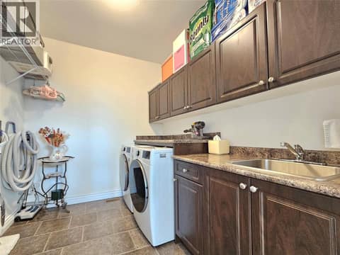 Laundry on the main floor at 1494 Montenegro Drive, Black Mountain, Kelowna
