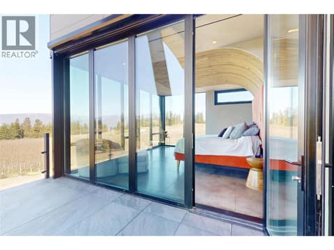 Access to main balcony from primary bedroom at 4275 Todd Road, South East Kelowna