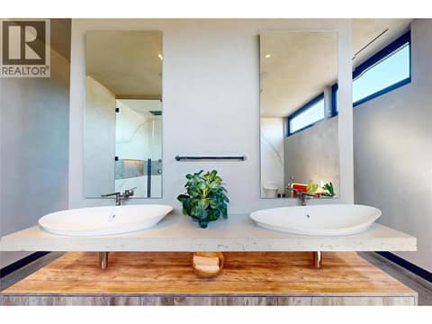 Custom Keith Crewe concrete slab vanity at 4275 Todd Road, South East Kelowna