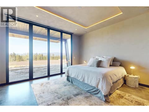 Lower level primary bedroom at 4275 Todd Road, South East Kelowna