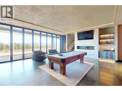 Lower level rec room with gas fireplace at 4275 Todd Road, South East Kelowna