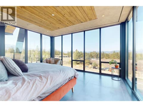 Primary bedroom with access to balcony at 4275 Todd Road, South East Kelowna