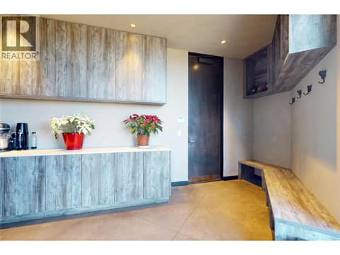 Spacious laundry room with access to attached garage at 4275 Todd Road, South East Kelowna