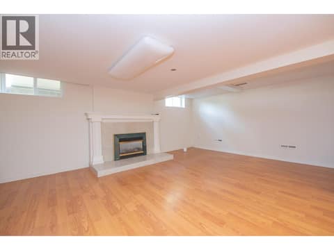 Basement - Family room with gas fireplace at 1851 Miller Street, Lumby Valley