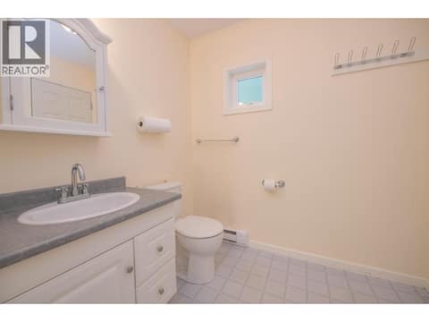 Office bathroom with easy access from Pool at 1851 Miller Street, Lumby Valley