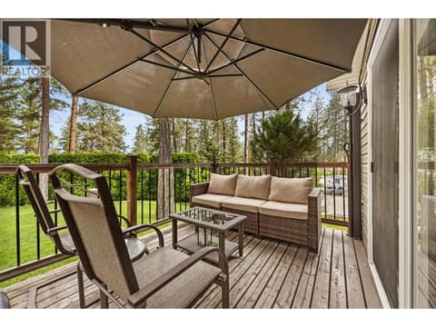 A comfortable covered seating area offers the perfect place to escape the afternoon sun while taking in the tranquil surroundings. at 4075 McClain Road Unit# 22, South East Kelowna